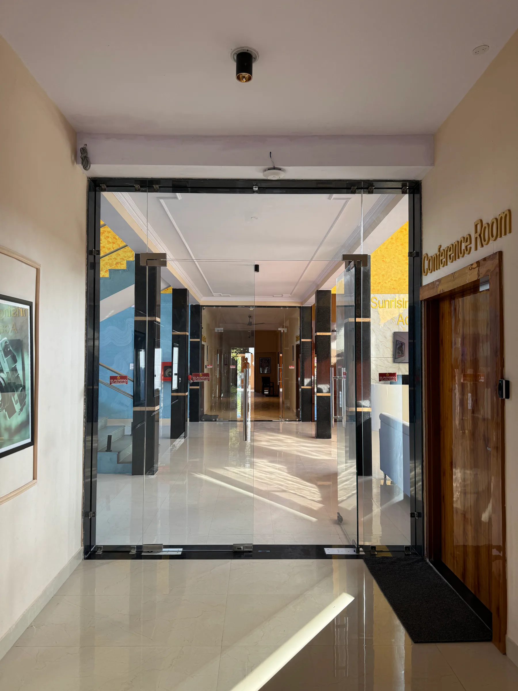 Frameless glass double doors and fixed partitions installed at a conference room in Jaipur
